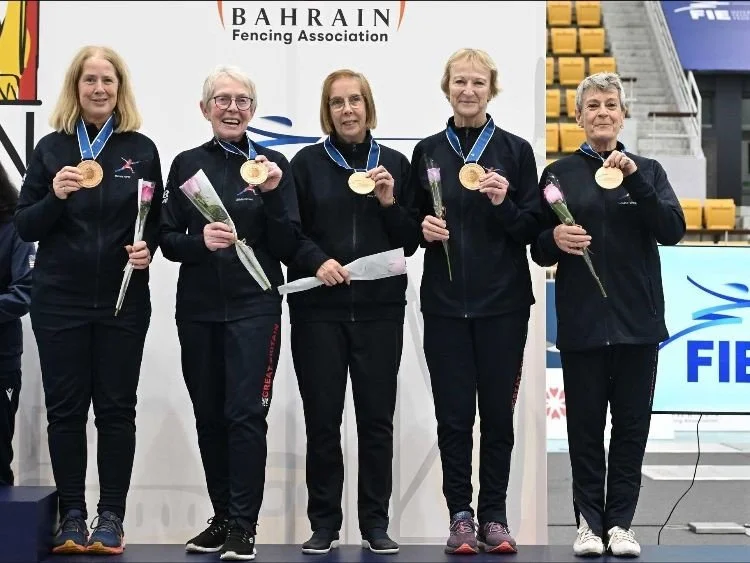 five GB women sabreurs in GB tracksuits showing their bronze medals with Scot michelle narey first on the left and the second scot in the team Sylvia Brown standing next to her